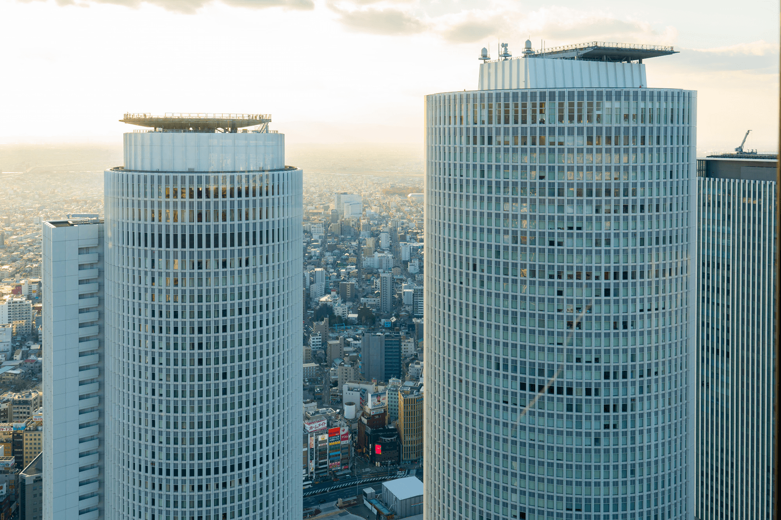 A cluster of high-rise towers over a dense cityscape
